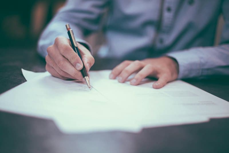 A lawyer signing documents